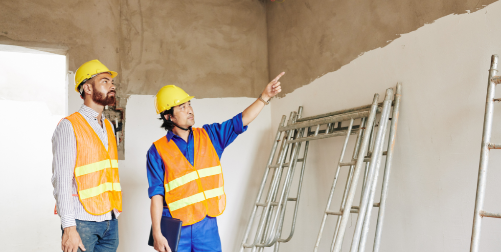 Man doing a survey of a building 